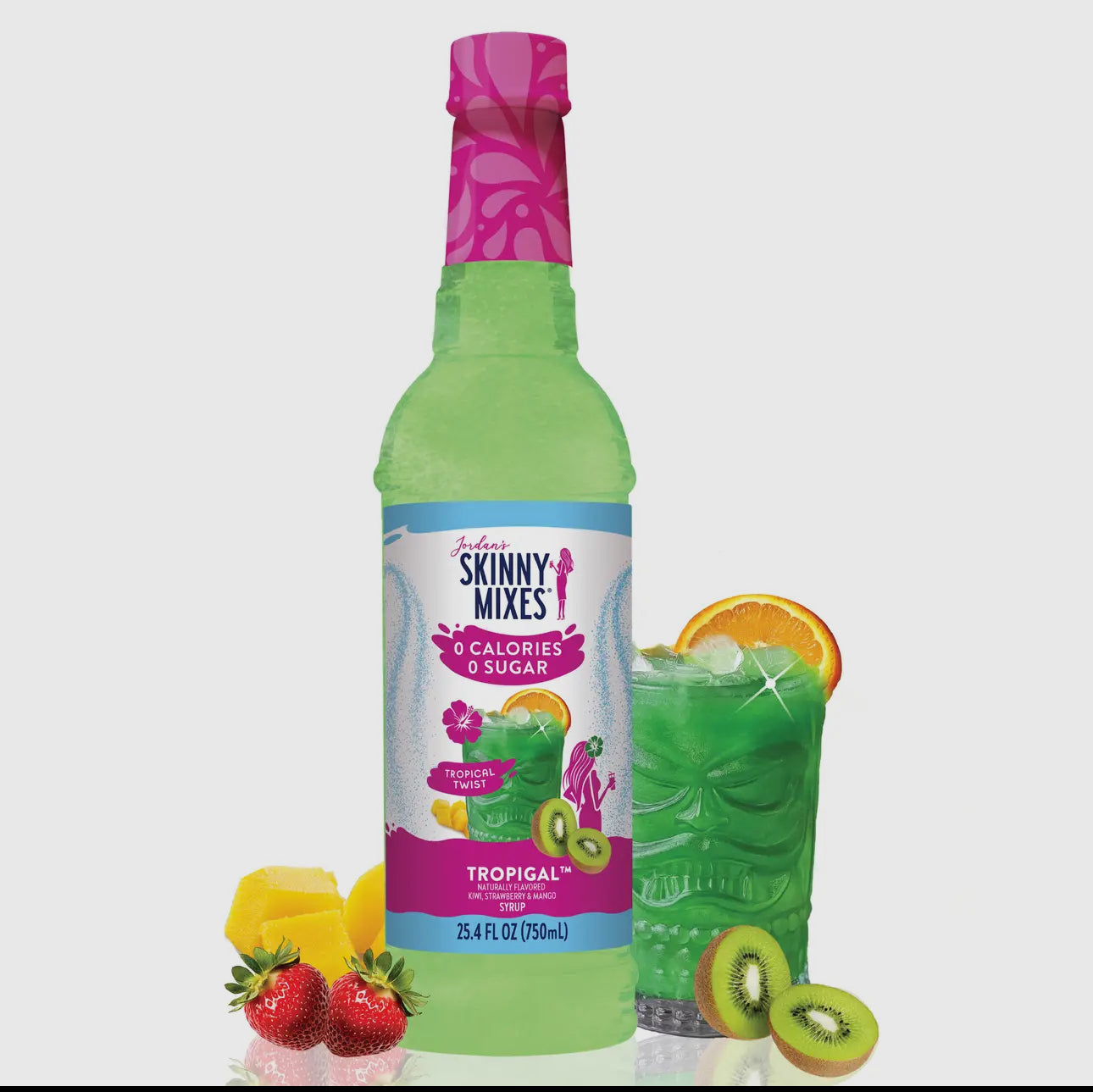 Green bottle of Skinny Mixes Tropical flavor with fruit slices on a white background